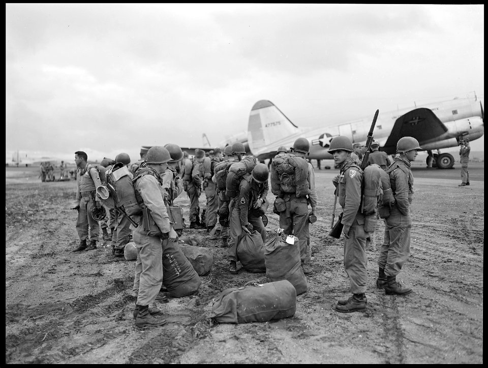 Battle equipped paratroopers of the 187th Regimental Combat Team wait to board C-46s of the 315th Combat Cargo Group... - NARA - 542268