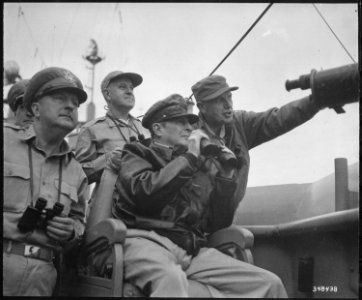 Brigadier General Courtney Whitney, General Douglas MacArthur, Commander in Chief of U.N. Forces, and Major General... - NARA - 531373 photo