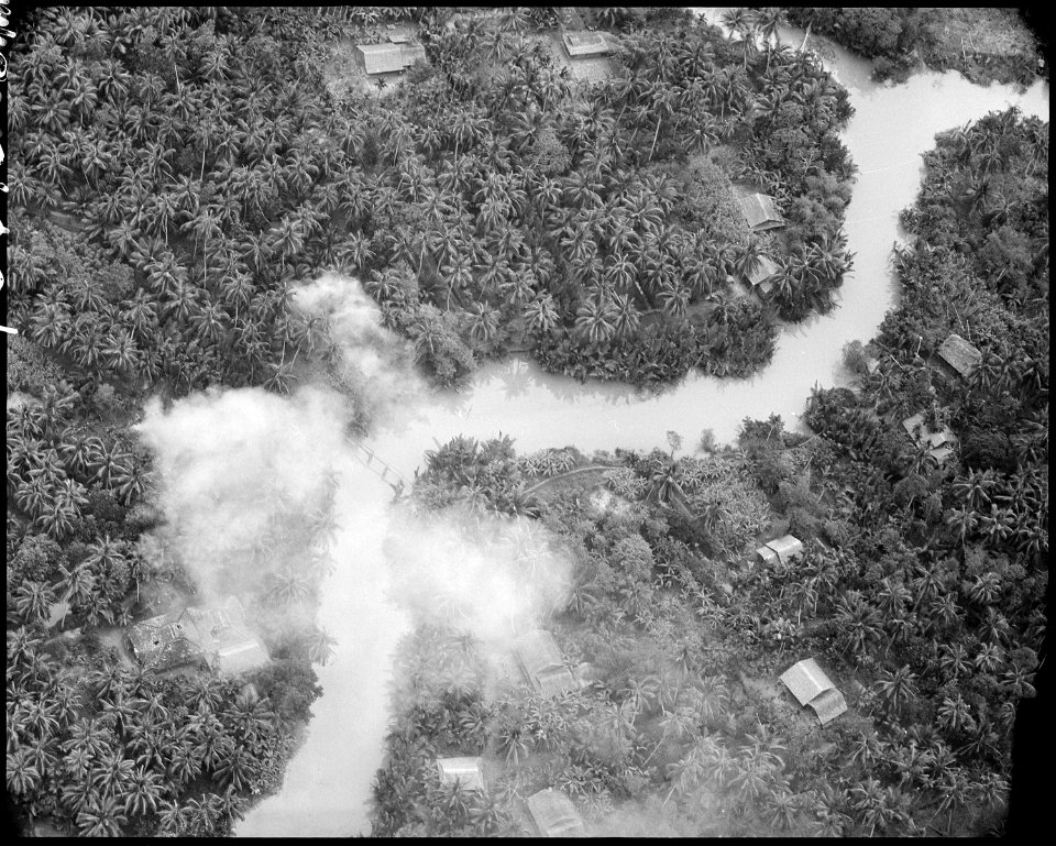 Bombing of Viet Cong structures along a canal in South Vietnam. - NARA - 542296