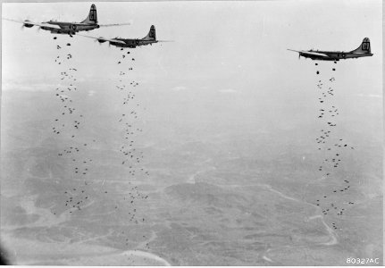Bomber Command planes of the U.S. Far East Air Forces rain tons of bombs on a strategic military target of the... - NARA - 542229