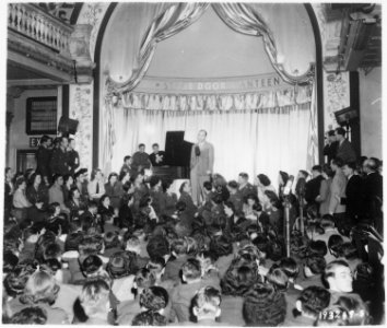 Bing Crosby, stage, screen and radio star, sings to Allied troops at the opening of the London stage door canteen in... - NARA - 531210
