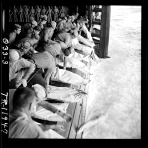 Burial at sea for the officers and men of the USS Intrepid (CV-11) who lost their lives when the carrier was hit by... - NARA - 520861