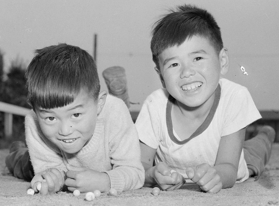 Boys playing marbles detail, Arcadia, California. Young evacuees demonstrate Japanese-style marbles at Santa Anita Assembly cent . . . - NARA - 537054 (cropped)
