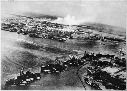 Captured Japanese photograph taken during the attack on Pearl Harbor, Dec. 7, 1941. In the distance, the smoke rises... - NARA - 520600