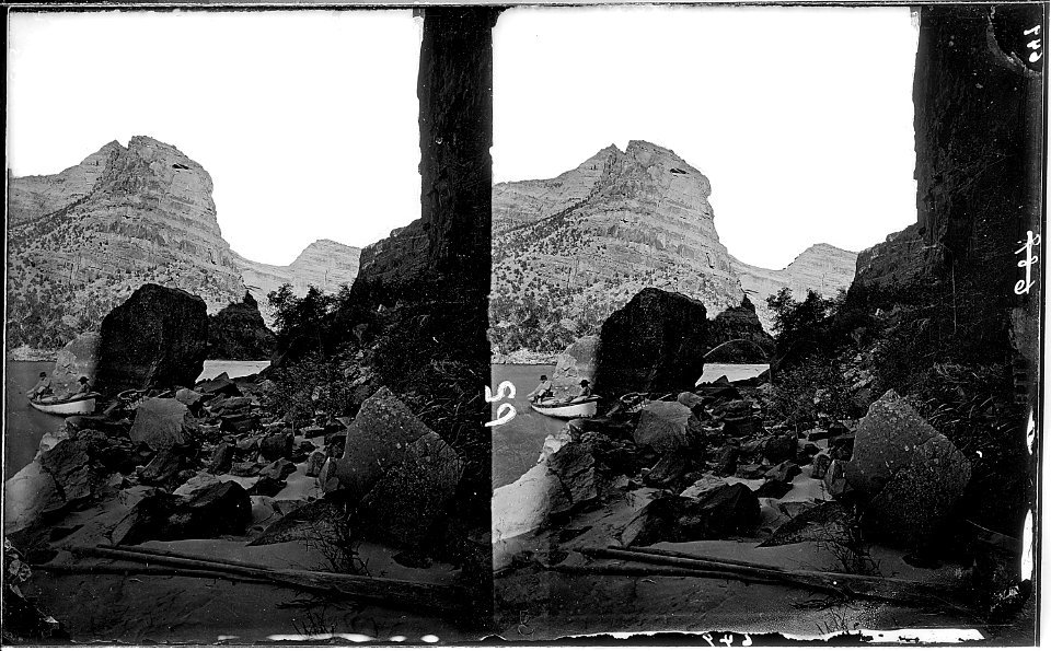 Canyon of Lodore. Near lower end, Green River. Left side of picture shows a boat with 2 men in it and rock obscures... - NARA - 517921