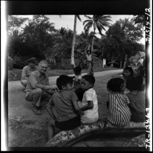 Capt. E.J. Steichen, Navy combat photographer, photographs native children on Guam Island. - NARA - 520943