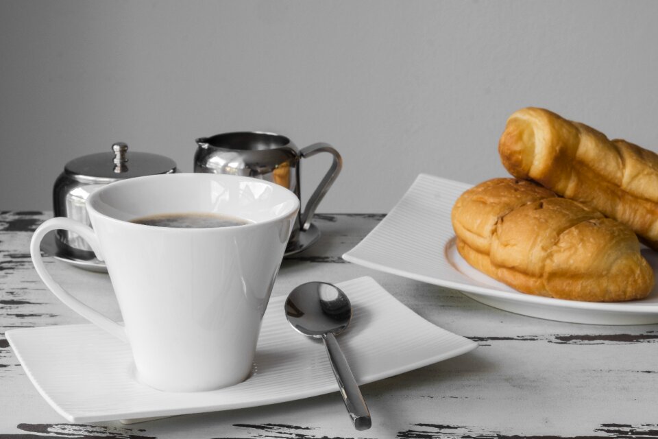 Coffee cup eat croissant