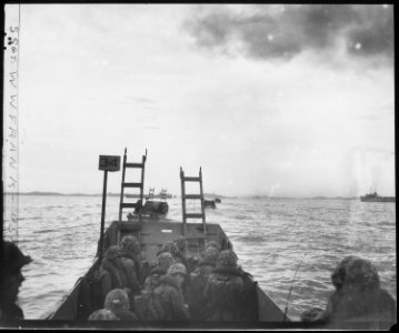 Carrying scaling ladders, U.S. Marines in landing crafts head for the seawall at Inchon. - NARA - 532403