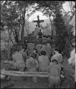Chaplain Kenny Lynch conducts services north of Hwachon, Korea, for men of 31st Regiment. - NARA - 531414 photo
