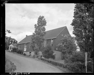 Catholic Church in midst of company housing project. Buckeye Coal Company, Nemacolin Mine, Nemacolin, Greene County... - NARA - 540323