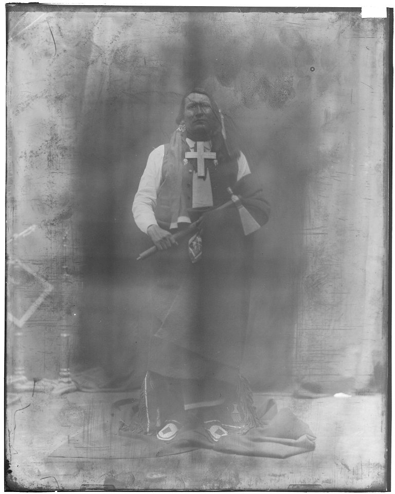Cheyenne with cross-wooden leg, full length (Not identified). - NARA - 523872