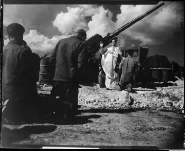 Chaplain Dennis Murphy celebrates mass for the men of 65th AAA Battalion, at Bolo Point, Okinawa. - NARA - 531413