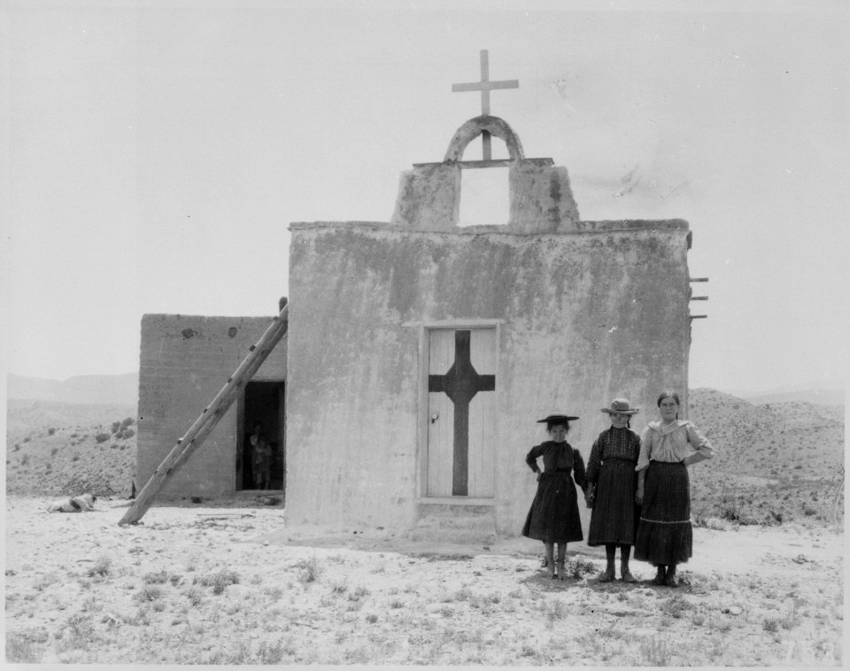 Children in their Sunday clothes pose in front of adobe church, Alamo National Forest, N. Mex. Terr. (now Lincoln Nation - NARA - 523027