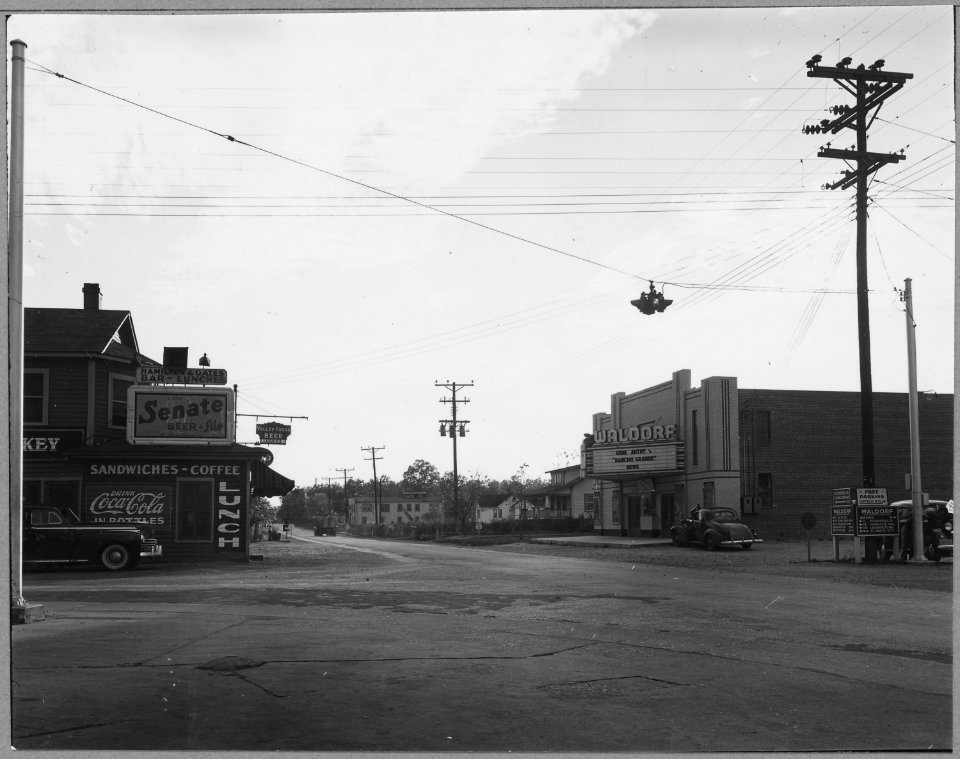 Charles County, Maryland. The new theatre is contrasted with the old-time bar-lunchroom across the h . . . - NARA - 521552