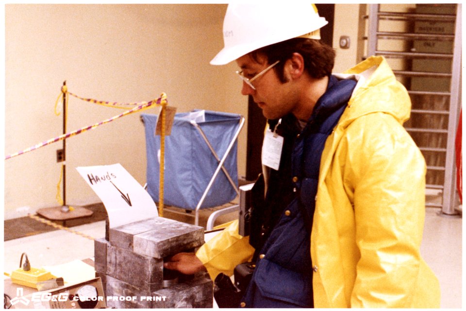 Checking hand for contamination - NARA - 540036