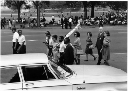 Civil Rights March on Washington, D.C. (Marchers walking and sitting under the trees.) - NARA - 542007