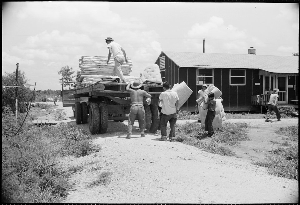 Closing of the Jerome Relocation Center, Denson, Arkansas. A crew is shown gathering mattresses fro . . . - NARA - 539792