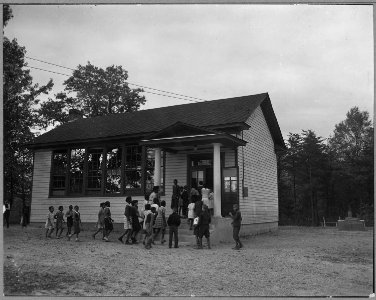 Charles County, Maryland. Pupils at the one-room elementary school for Negroes at Waldorf come in af . . . - NARA - 521560 photo