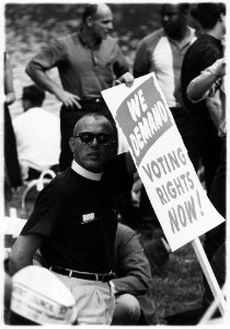 Civil Rights March on Washington, D.C. (A man holding a sign that reads We Demand Voting Rights Now) - NARA - 542036