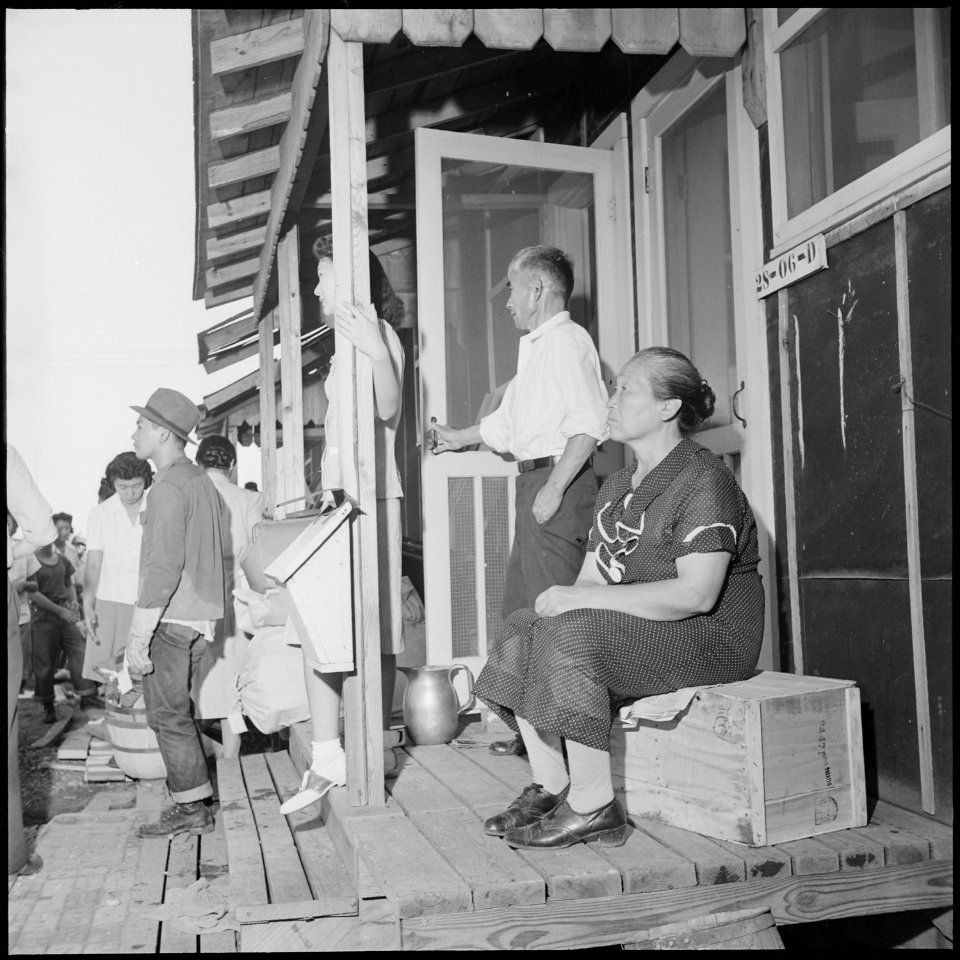Closing of the Jerome Relocation Center, Denson, Arkansas. An Issei couple sit on their porch and w . . . - NARA - 539783