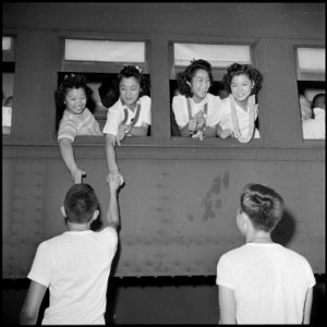Closing of the Jerome Relocation Center, Denson, Arkansas. Four young high school students leaving . . . - NARA - 539806