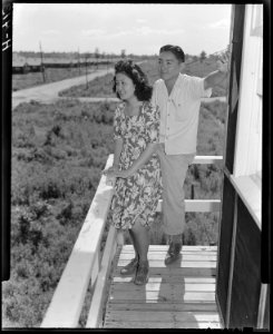 Closing of the Jerome Relocation Center, Denson, Arkansas. Clara Hasegawa and Tad Mijake take a las . . . - NARA - 539628