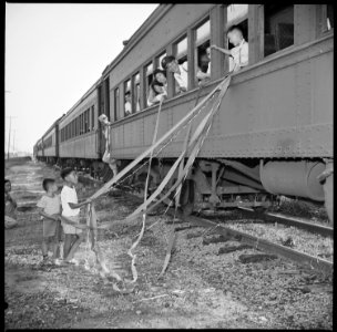 Closing of the Jerome Relocation Center, Denson, Arkansas. A sentimental custom still practiced by . . . - NARA - 539666