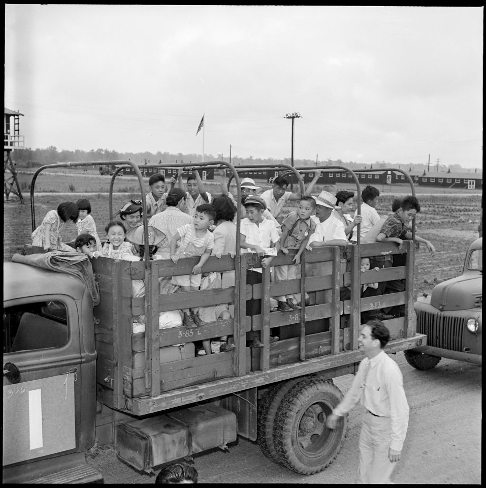 Closing of the Jerome Relocation Center, Denson, Arkansas. A typical truck load of evacuees waiting . . . - NARA - 539796