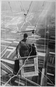 Close-up view of an American major in the basket of an observation balloon flying over territory near front lines.... - NARA - 530737