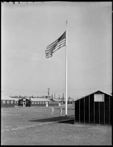 Closing of the Jerome Relocation Center, Denson, Arkansas. Old Glory is lowered for the last time . . . - NARA - 539671