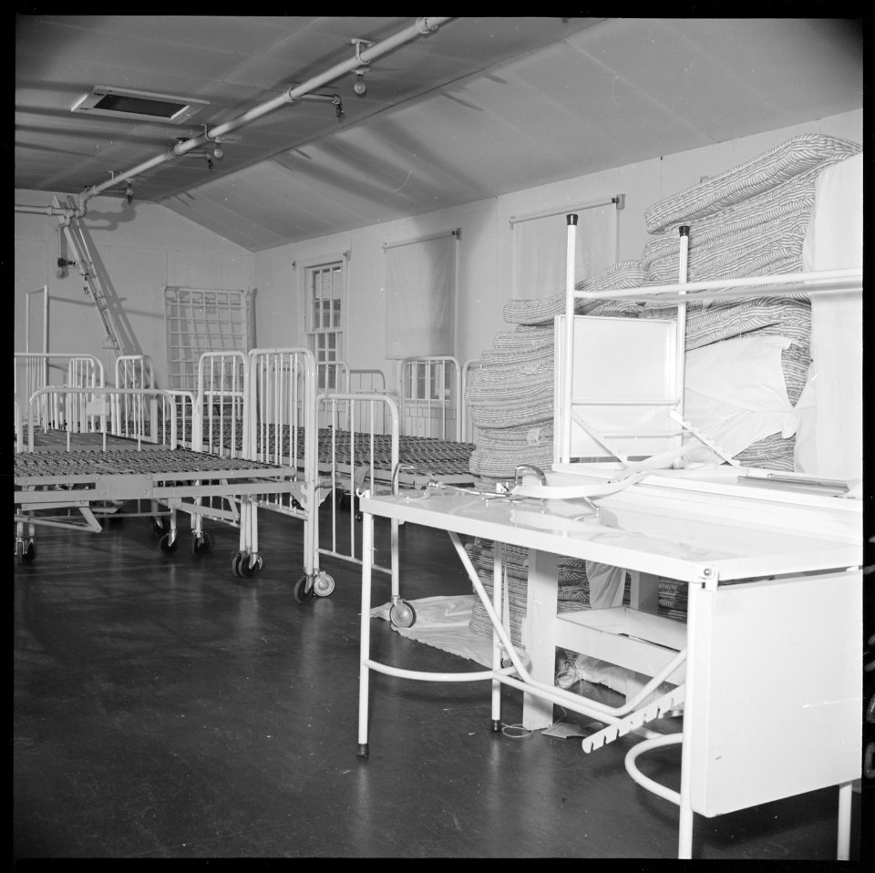 Closing of the Jerome Relocation Center, Denson, Arkansas. Hospital beds and mattresses assembled i . . . - NARA - 539637