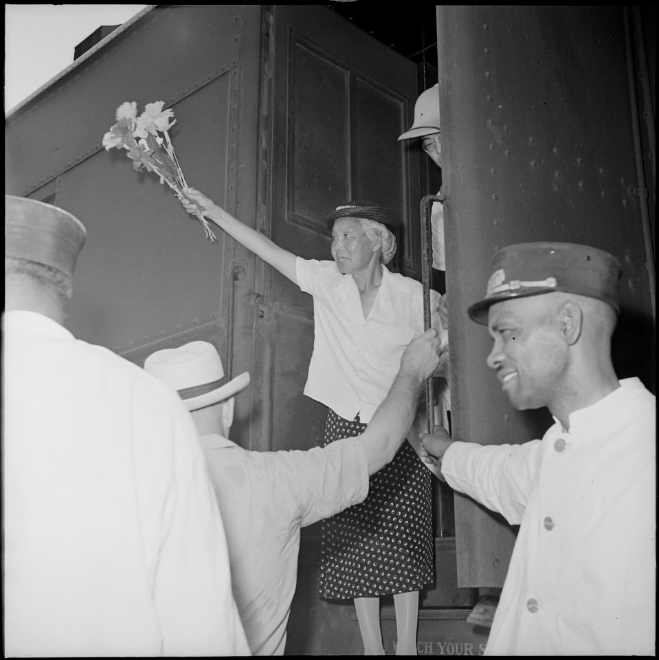 Closing of the Jerome Relocation Center, Denson, Arkansas. An elderly Issei woman waved a bunch of . . . - NARA - 539747
