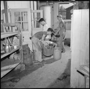 Closing of the Jerome Relocation Center, Denson, Arkansas. Carrying equipment from one of the disma . . . - NARA - 539735