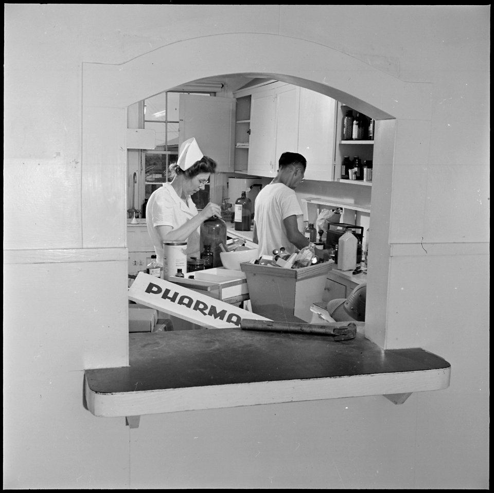Closing of the Jerome Relocation Center, Denson, Arkansas. Dismantling the hospital pharmacy and pa . . . - NARA - 539776