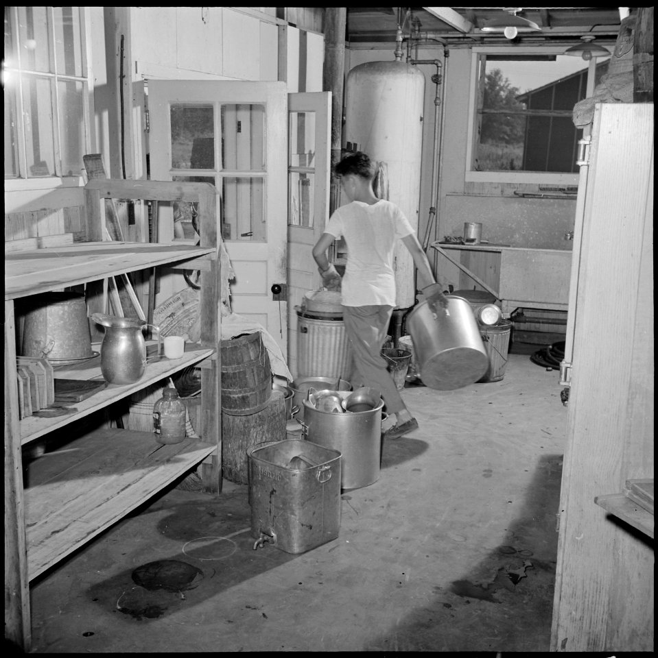 Closing of the Jerome Relocation Center, Denson, Arkansas. Dismantling one of Jerome's thirty-three . . . - NARA - 539734