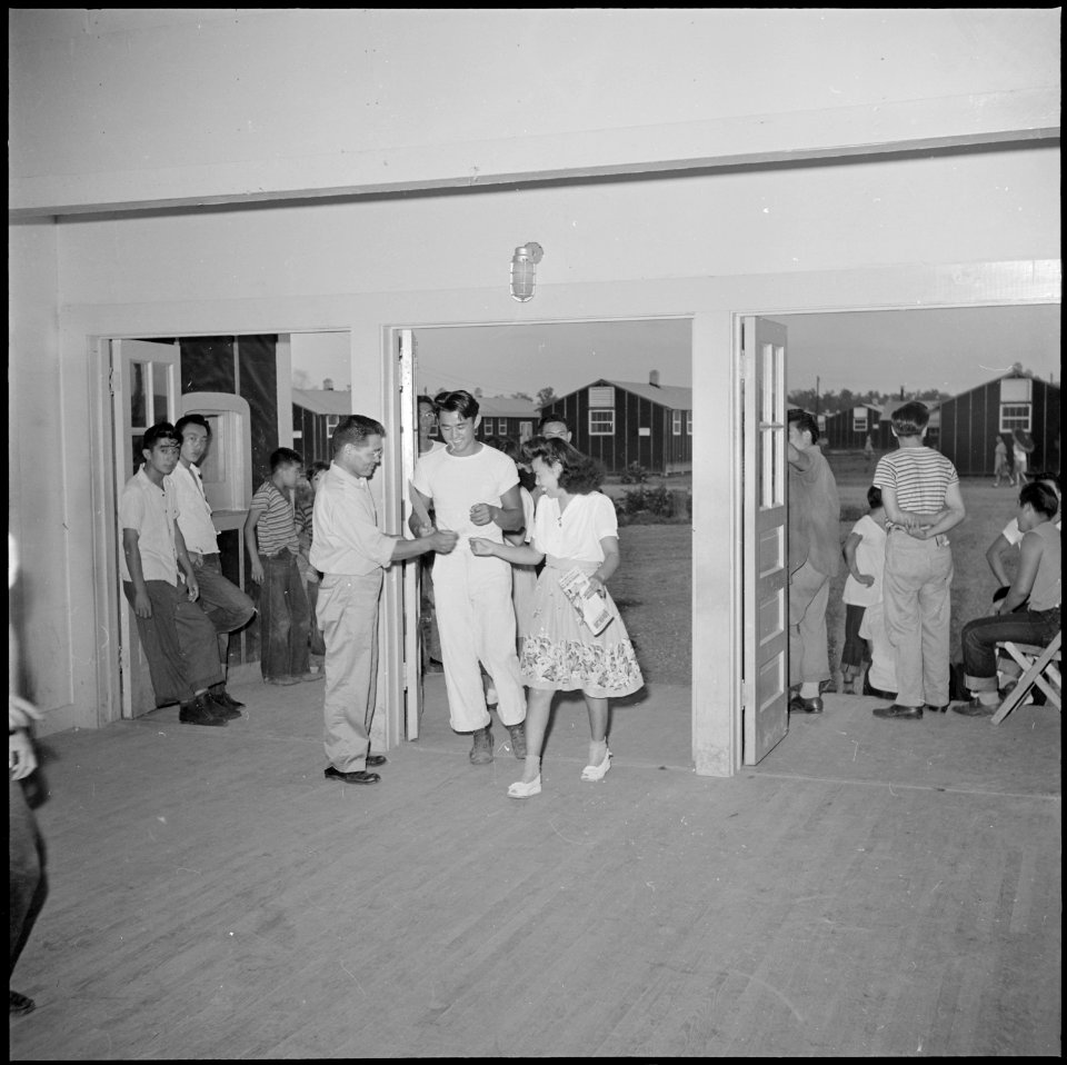 Closing of the Jerome Relocation Center, Denson, Arkansas. Jerome young folks are seen entering the . . . - NARA - 539807