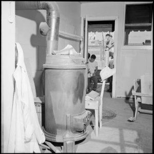 Closing of the Jerome Relocation Center, Denson, Arkansas. The sheet iron stove, prominent fixture . . . - NARA - 539810