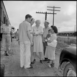 Closing of the Jerome Relocation Center, Denson, Arkansas. Robert Allison, Leave Officer, (left) an . . . - NARA - 539743