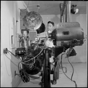 Closing of the Jerome Relocation Center, Denson, Arkansas. View in the projection booth of the cent . . . - NARA - 539790