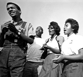 Civil Rights March on Washington, D.C. (Four young marchers singing.) - NARA - 542025 photo