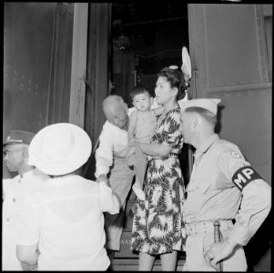 Closing of the Jerome Relocation Center, Denson, Arkansas. Pullman passengers, a mother and child a . . . - NARA - 539798