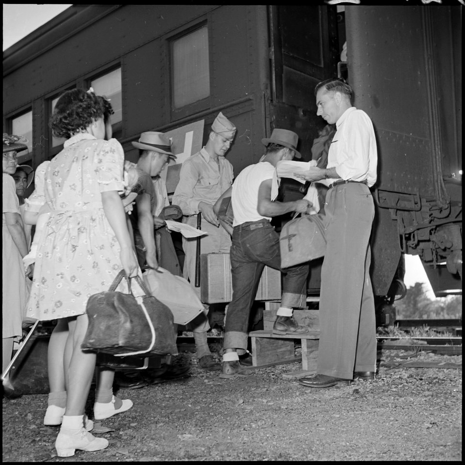 Closing of the Jerome Relocation Center, Denson, Arkansas. Typical scene in the chair car entrances . . . - NARA - 539756