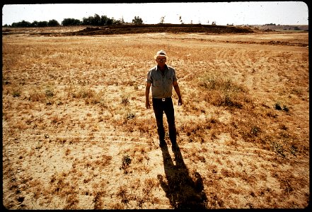 CLYDE KEPLEY, OWNER OF SANITARY LAND FILL, STANDS ON HIS 13 ACRE FINISHED AREA, WHICH HAS FILL - NARA - 542548