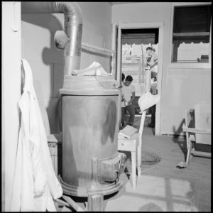 Closing of the Jerome Relocation Center, Denson, Arkansas. The sheet iron stove, prominent fixture . . . - NARA - 539810