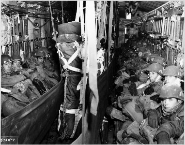 COMBAT CARGO, KOREA - Paratroopers of the 187th Airborne Regimental Combat Team, seated in the cargo compartment of... - NARA - 542315 photo