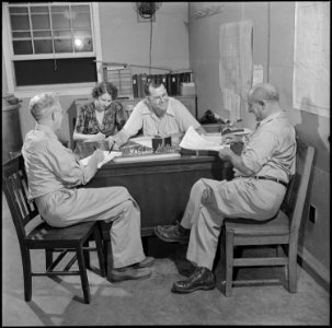 Closing of the Jerome Relocation Center, Denson, Arkansas. W. H. Jenkins, left, motor pool superint . . . - NARA - 539738