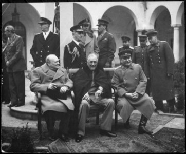 Conference of the Big Three at Yalta makes final plans for the defeat of Germany. Here the Big Three sit on the... - NARA - 531340