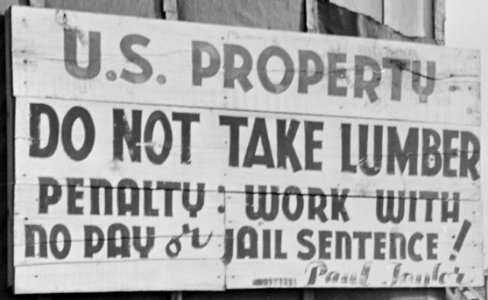 Closing of the Jerome Relocation Center, Denson, Arkansas. Old sign at the Jerome Center's lumber yard. - NARA - 539740 (cropped) photo