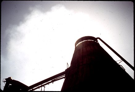 CONVERTED WIGWAM BURNER AT PINE INDUSTRY MILL WHICH RECYCLES HEAT, REDUCING SMOKE AND INCREASING - NARA - 542591
