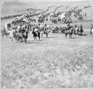 Column of cavalry, artillery, and wagons, commanded by Gen. George A. Custer, crossing the plains of Dakota Territory. B - NARA - 519427 photo
